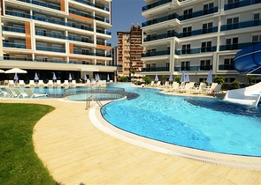 اطلالة بحر - شقة غرفة وصالة - ضمن مجمع 5 نجوم - في منطقة توسمور / الانيا 