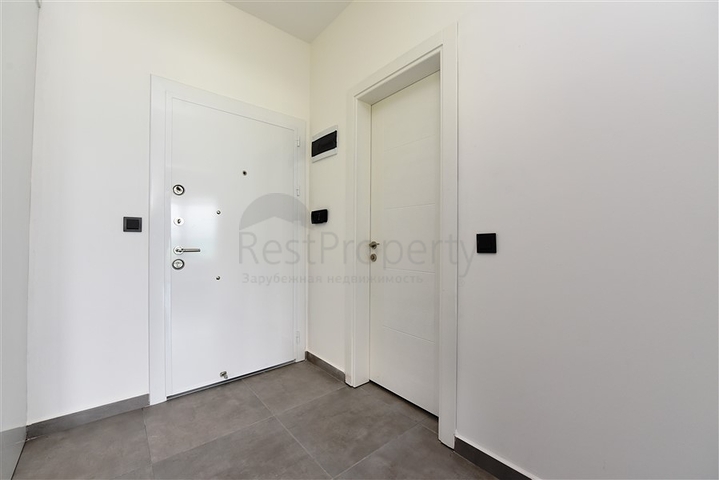 ضمن مجمع يضم كافة الخدمات - شقة مؤثثة من تصميم غرفة وصالة - في مهموتلار / الانيا 