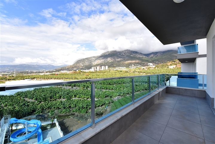 ضمن مجمع يضم كافة الخدمات - شقة مؤثثة من تصميم غرفة وصالة - في مهموتلار / الانيا 