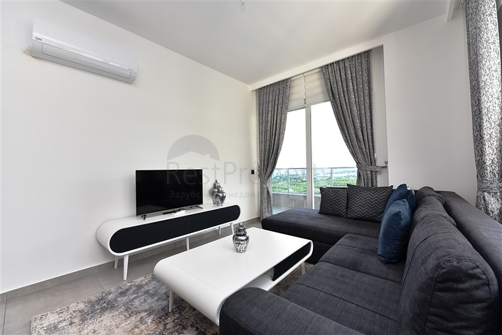 ضمن مجمع يضم كافة الخدمات - شقة مؤثثة من تصميم غرفة وصالة - في مهموتلار / الانيا 