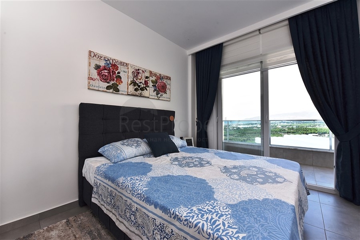 ضمن مجمع يضم كافة الخدمات - شقة مؤثثة من تصميم غرفة وصالة - في مهموتلار / الانيا 