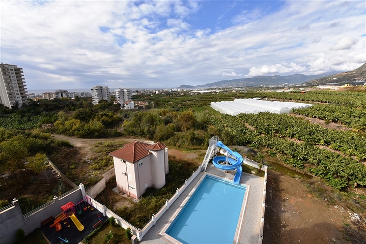 ضمن مجمع يضم كافة الخدمات - شقة مؤثثة من تصميم غرفة وصالة - في مهموتلار / الانيا 