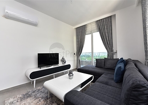 ضمن مجمع يضم كافة الخدمات - شقة مؤثثة من تصميم غرفة وصالة - في مهموتلار / الانيا 