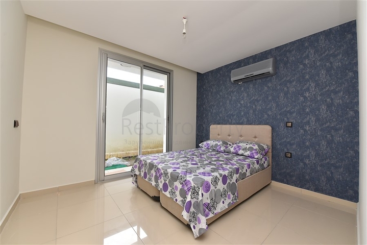 دوبلكس ارضية - تصميم غرفتين وصالة - ضمن مجمع يضم كافة الخدمات في كاستل / الانيا 