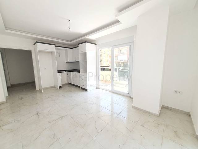 ضمن بناء جديد - شقة غرفة وصالة - واسعة - قريبة من البحر - في مهموتلار / الانيا 