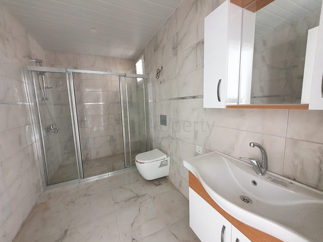 ضمن بناء جديد - شقة غرفة وصالة - واسعة - قريبة من البحر - في مهموتلار / الانيا 