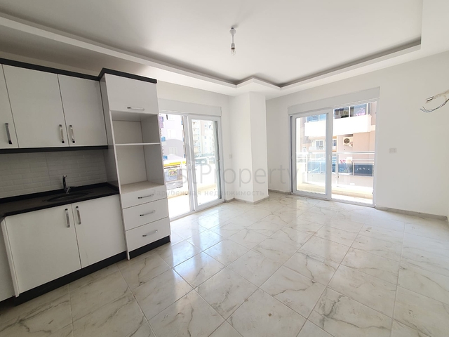 ضمن بناء جديد - شقة غرفة وصالة - واسعة - قريبة من البحر - في مهموتلار / الانيا 