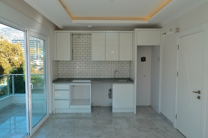 شقق قريبة من البحر - باسعار مناسبة - تصميم 1+1 - في مهموتلار / الانيا 