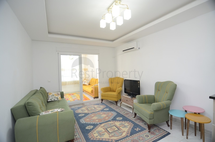 بسعر اقتصادي - شقة غرفة وصالة مع بالكون مغلق - مؤثثة -ضمن مجمع في مهموتلار / الانيا 