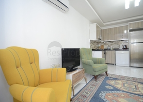 بسعر اقتصادي - شقة غرفة وصالة مع بالكون مغلق - مؤثثة -ضمن مجمع في مهموتلار / الانيا 