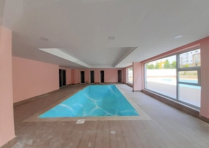 ضمن مجمع سكني حديث -شقة غرفتين وصالة مفروشة - في مهموتلار / الانيا 