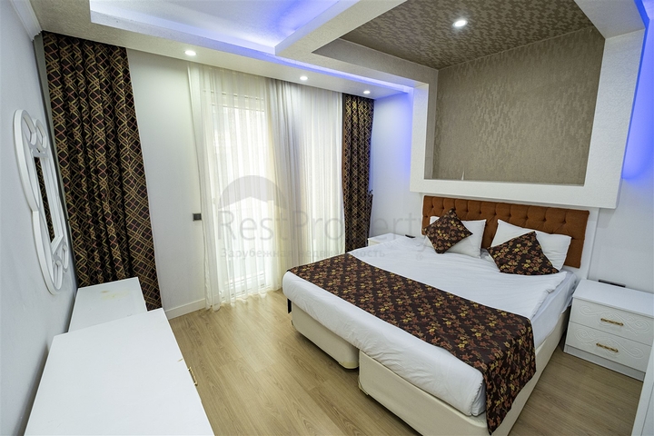 شقة 2 + 1 مع أثاث في مجمع مخطط فندقي في أنطاليا