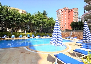 شقة 2 غرفتين وصالة - مفروشة -ضمن مجمع سكني - في منطقة توسمور المركزية / الانيا 