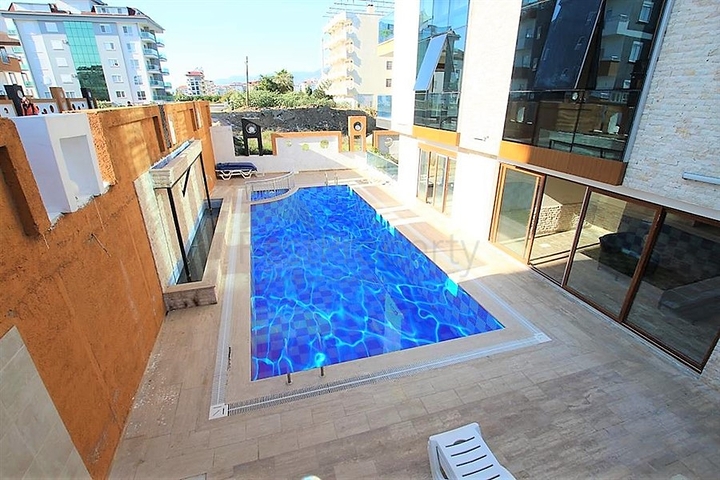 شقة 1+1 - مفروشة - ضمن مجمع قريب من البحر - في كاستل / الانيا 