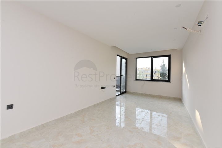 شقة 2 غرفة وصالة -ضمن مجمع سكني حديث -في مركز الانيا 