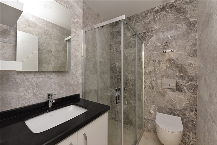 شقة 2 غرفة وصالة -ضمن مجمع سكني حديث -في مركز الانيا 