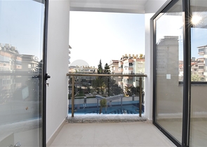 شقة 2 غرفة وصالة -ضمن مجمع سكني حديث -في مركز الانيا 