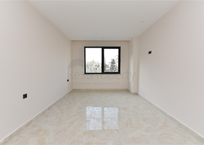 شقة 2 غرفة وصالة -ضمن مجمع سكني حديث -في مركز الانيا 