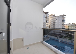 شقة 2 غرفة وصالة -ضمن مجمع سكني حديث -في مركز الانيا 