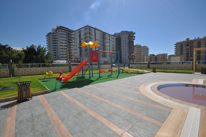 طابق مرتفع - اطلالة جبلية رائعة - شقة 1+1 - ضمن مجمع يضم كافة الخدمات - مهموتلار / الانيا 