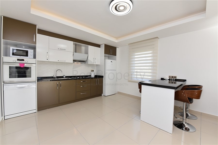 طابق مرتفع - اطلالة جبلية رائعة - شقة 1+1 - ضمن مجمع يضم كافة الخدمات - مهموتلار / الانيا 