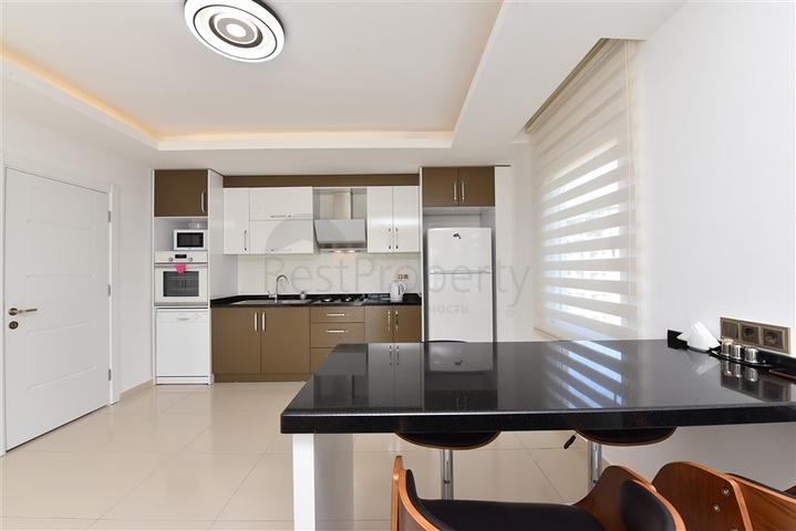 طابق مرتفع - اطلالة جبلية رائعة - شقة 1+1 - ضمن مجمع يضم كافة الخدمات - مهموتلار / الانيا 