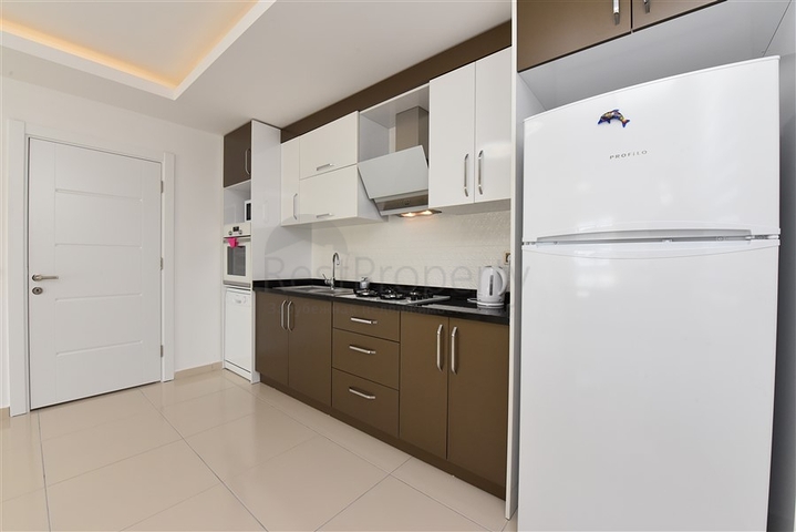 طابق مرتفع - اطلالة جبلية رائعة - شقة 1+1 - ضمن مجمع يضم كافة الخدمات - مهموتلار / الانيا 