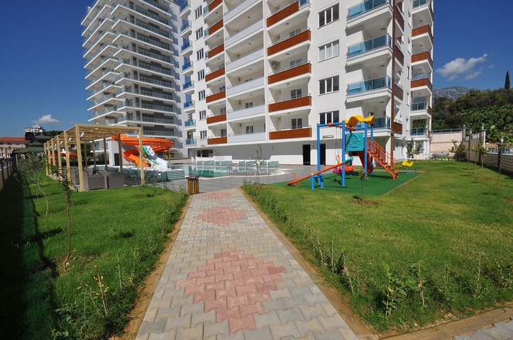 طابق مرتفع - اطلالة جبلية رائعة - شقة 1+1 - ضمن مجمع يضم كافة الخدمات - مهموتلار / الانيا 