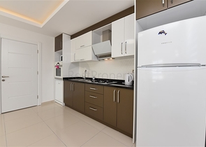 طابق مرتفع - اطلالة جبلية رائعة - شقة 1+1 - ضمن مجمع يضم كافة الخدمات - مهموتلار / الانيا 