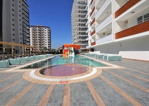 طابق مرتفع - اطلالة جبلية رائعة - شقة 1+1 - ضمن مجمع يضم كافة الخدمات - مهموتلار / الانيا 