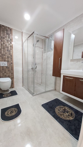 شقة غرفة وصالة -واسعة نسبيا / 83 م / - ضمن مجمع - في مهموتلار / الانيا 