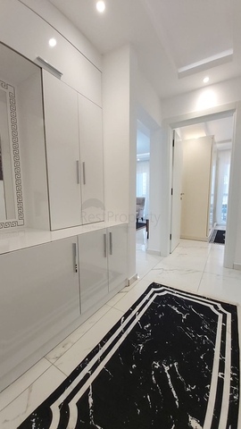 شقة غرفة وصالة -واسعة نسبيا / 83 م / - ضمن مجمع - في مهموتلار / الانيا 