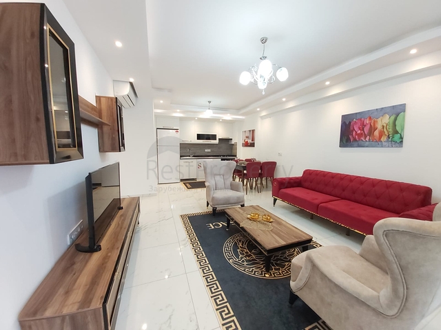 شقة غرفة وصالة -واسعة نسبيا / 83 م / - ضمن مجمع - في مهموتلار / الانيا 