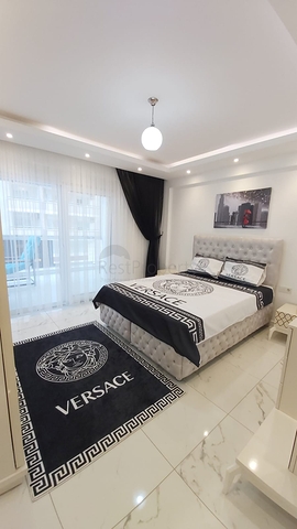 شقة غرفة وصالة -واسعة نسبيا / 83 م / - ضمن مجمع - في مهموتلار / الانيا 