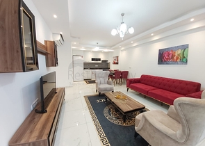 شقة غرفة وصالة -واسعة نسبيا / 83 م / - ضمن مجمع - في مهموتلار / الانيا 