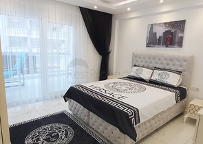 شقة غرفة وصالة -واسعة نسبيا / 83 م / - ضمن مجمع - في مهموتلار / الانيا 