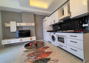 شقة غرفة وصالة -مؤثثة - ضمن مجمع سكني جديد - في مهموتلار / الانيا 