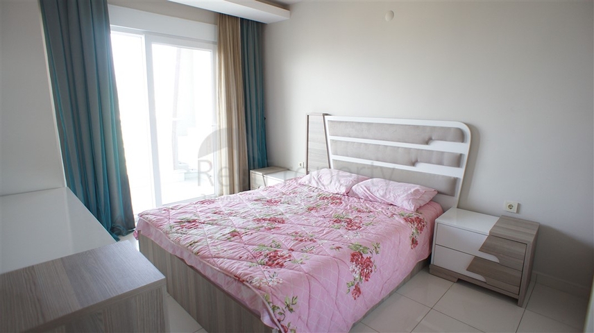 شقة مفروشة - غرفة نوم وصالة - ضمن مجمع قريب من البحر والخدمات - الانيا / مهموتلار 