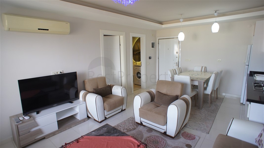 شقة مفروشة - غرفة نوم وصالة - ضمن مجمع قريب من البحر والخدمات - الانيا / مهموتلار 