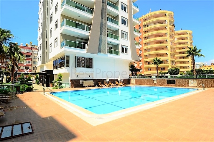 شقة مفروشة - غرفة نوم وصالة - ضمن مجمع قريب من البحر والخدمات - الانيا / مهموتلار 