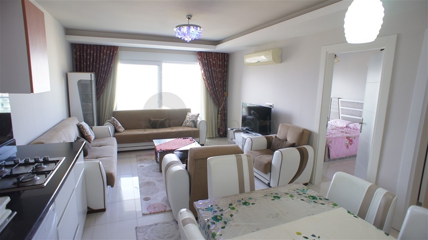 شقة مفروشة - غرفة نوم وصالة - ضمن مجمع قريب من البحر والخدمات - الانيا / مهموتلار 