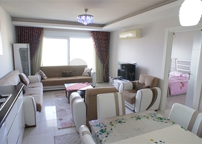 شقة مفروشة - غرفة نوم وصالة - ضمن مجمع قريب من البحر والخدمات - الانيا / مهموتلار 