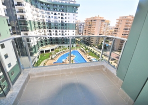 شقة ضمن مجمع بخدمات فاخرة -في الانيا / محمودلار 