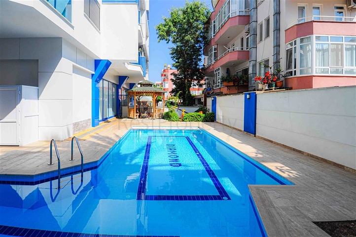 شقة للبيع في اوبا بسعر مناسب - غرفة وصالة ضمن مجمع حديث - قريبة من البحر -اوبا / الانيا 