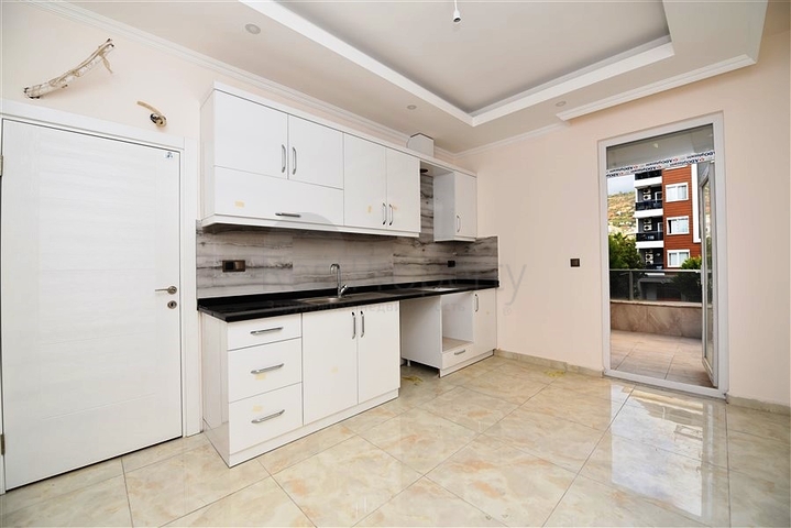 مطبخ منفصل - شقة 2 غرفة وصالة -جديدة- في مركز الانيا 