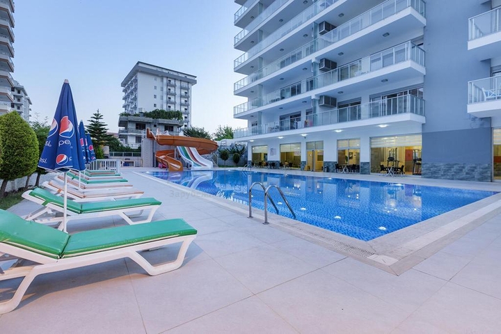 شقة واسعة - غرفة نوم وصالة -اثاث انيق -في محمودلار / الانيا 