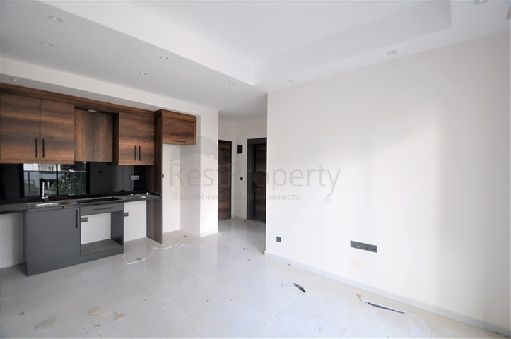 مناسبة للعطلات والاستثمار -شقة 1+1 ضمن مجمع حديث في محمودلار/ الانيا 