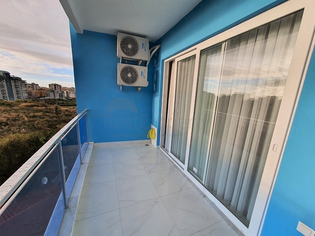 شقة غرفة وصالة جديدة - مفروشة وضمن مجمع سكني في محمودلار / الانيا 