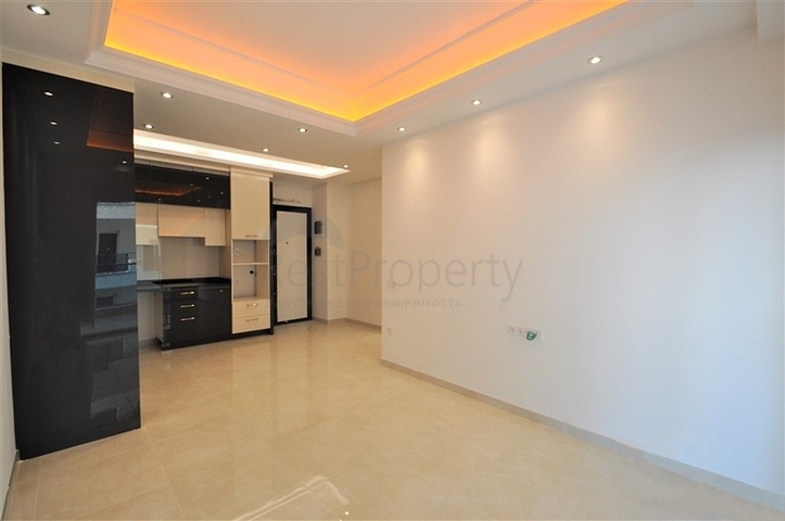 ضمن مجمع 5 نجوم - شقة غرفة وصالة واسعة نسبيا - في محمودلار / الانيا 