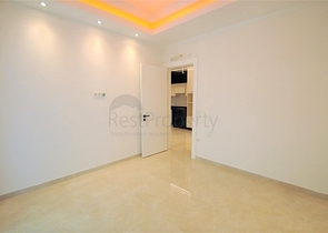 ضمن مجمع 5 نجوم - شقة غرفة وصالة واسعة نسبيا - في محمودلار / الانيا 